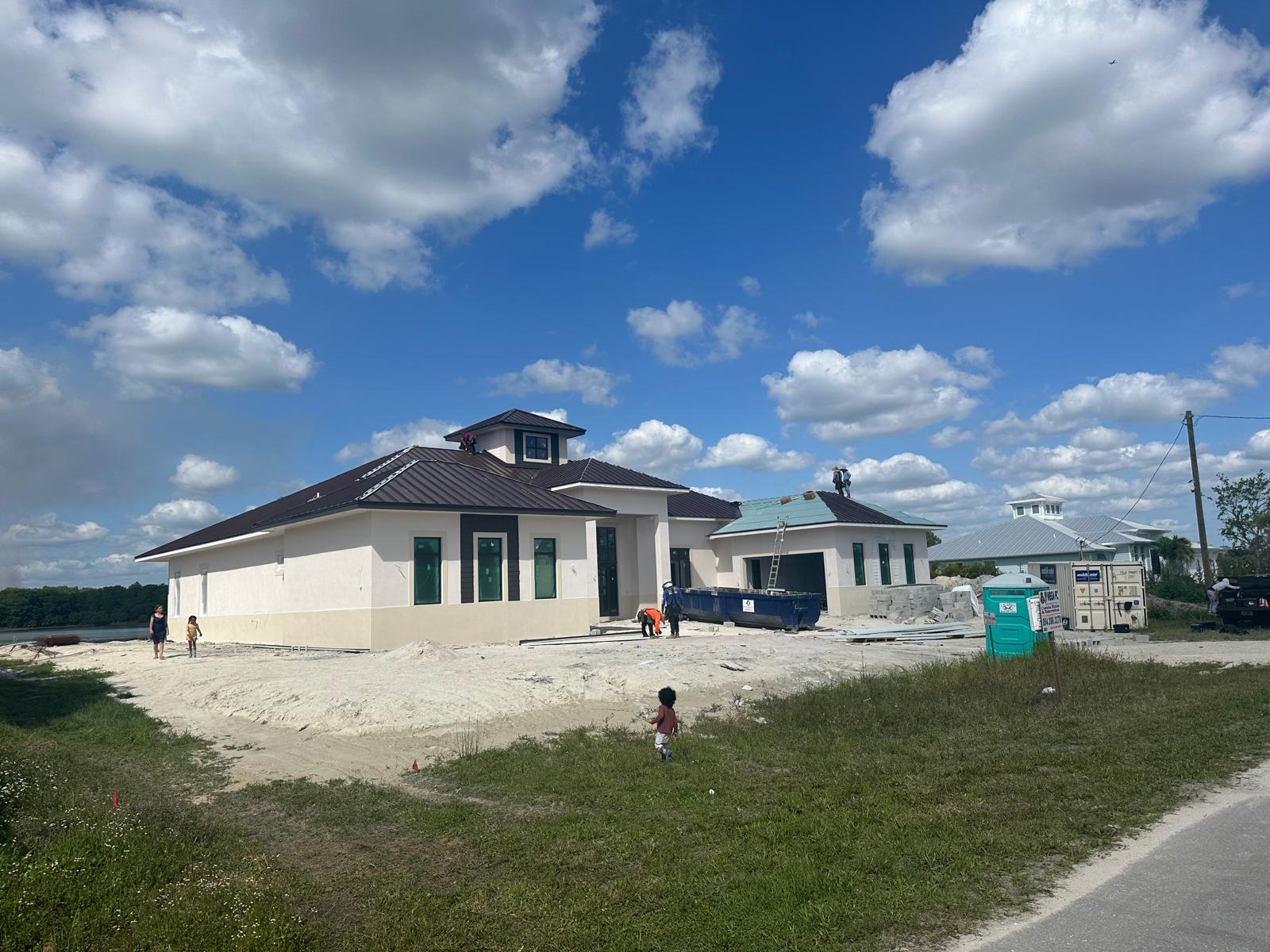 Construction progress - metal roof installation side view Naples FL